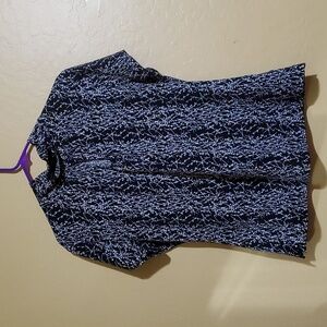 Womens medium black and white blouse with peep hole neck.